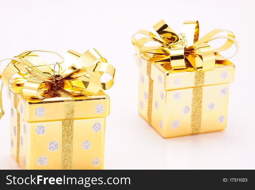 Golden gift boxes on white