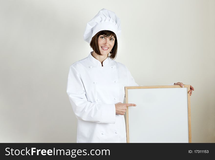 Beautiful female Chef with Blackboard. Beautiful female Chef with Blackboard