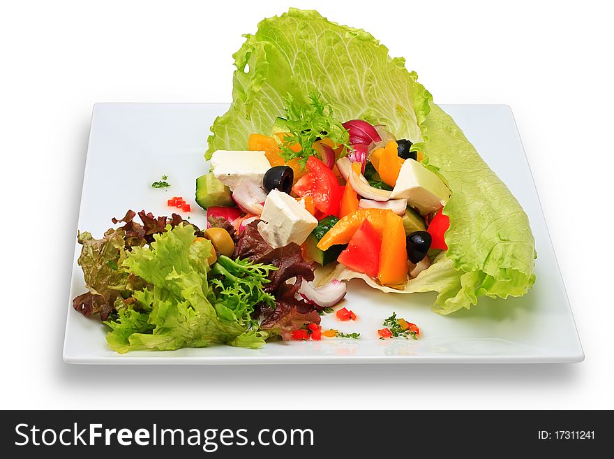 Vegetarian salad with fresh vegetables on a ceramic platter