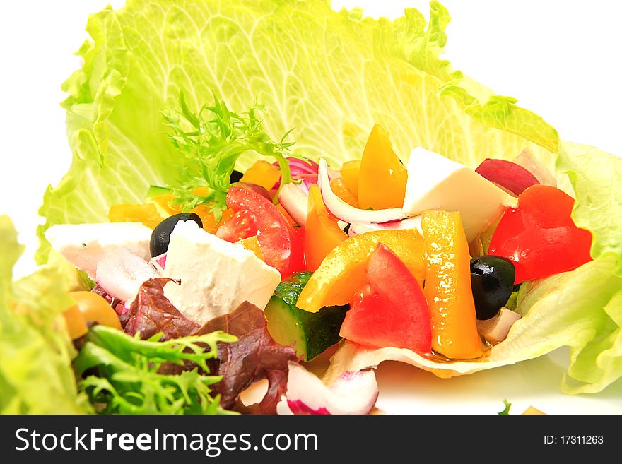 Vegetarian salad with fresh vegetables on a ceramic platter