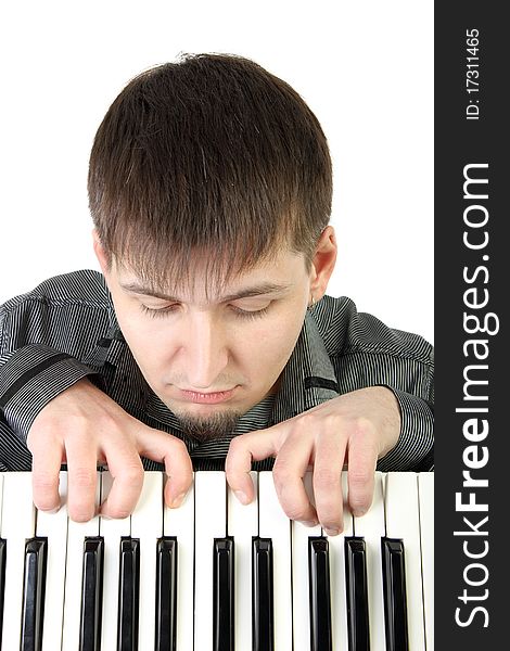 Young man playing the piano isolated background