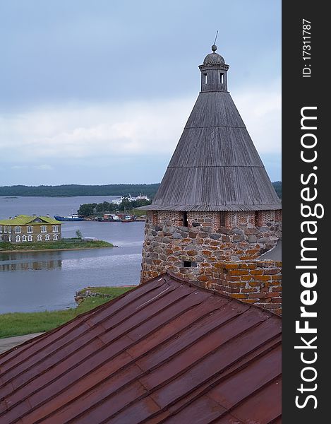 Old round stone tower in Solovetsky monastery with blue sky background, Karelia, Russian Federation. Old round stone tower in Solovetsky monastery with blue sky background, Karelia, Russian Federation.