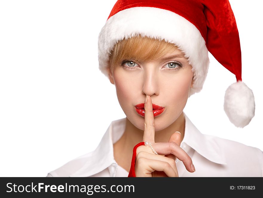 Beautiful santa clause blond woman hat with silence gesture, isolated on white background. Beautiful santa clause blond woman hat with silence gesture, isolated on white background