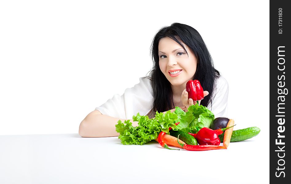 Beautiful woman with vegetables over white background. Beautiful woman with vegetables over white background