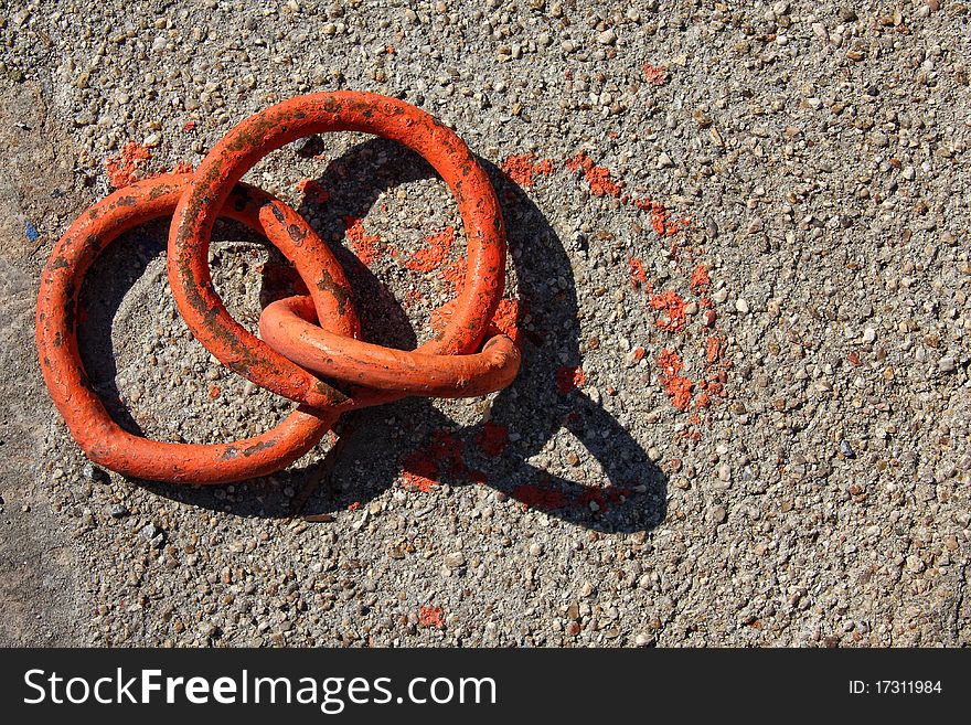 Orange boat hooks on marine concrete platform texture. Orange boat hooks on marine concrete platform texture