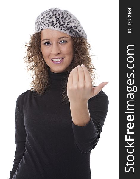 A young girl doing a gesture with her hand an calling for someone