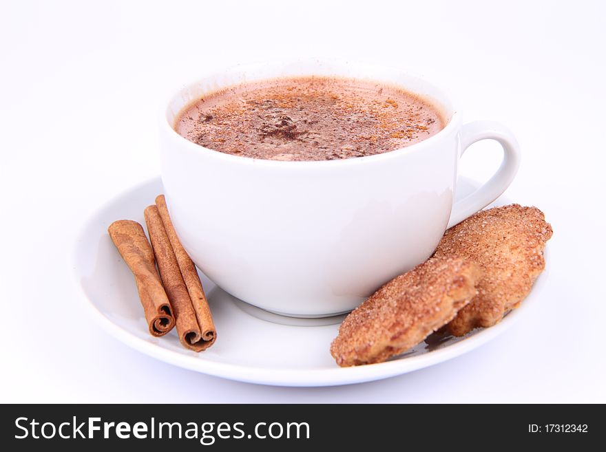 Cup of hot chocolate with cinnamon and cinnamon cookies on white background. Cup of hot chocolate with cinnamon and cinnamon cookies on white background