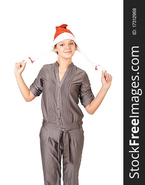 Young woman in a Santa Claus hat on white background
