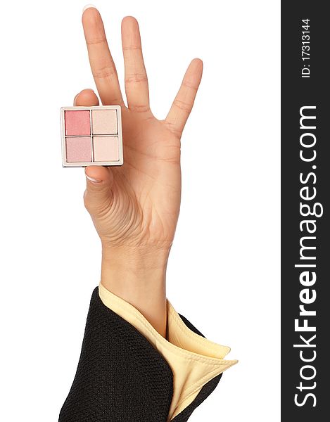 Woman holding in the hand one quadrate with colored eye shadow. Woman holding in the hand one quadrate with colored eye shadow