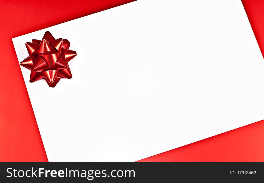 On a red background white greeting card with a red Bantu. On a red background white greeting card with a red Bantu.