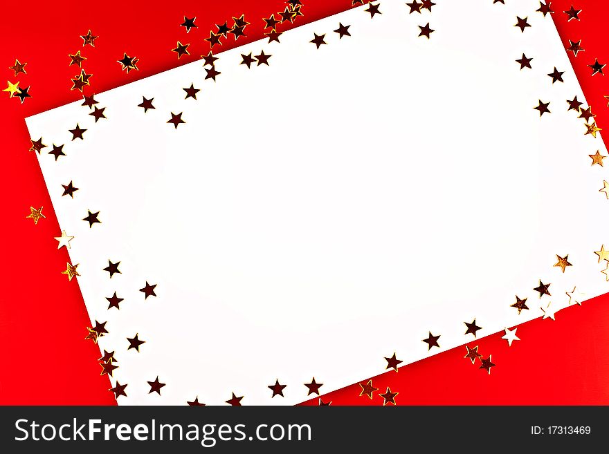 On a red background white greeting card with golden stars. On a red background white greeting card with golden stars.
