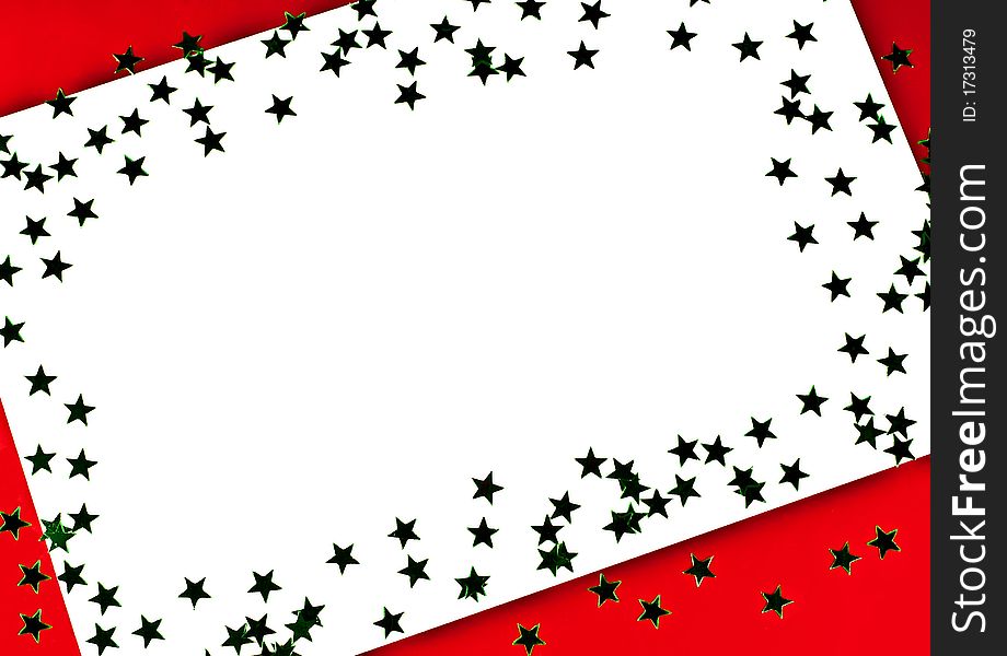 On a red background white greeting card with green stars. On a red background white greeting card with green stars