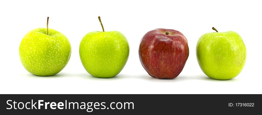 Green apple with the red one standing isolated on white background