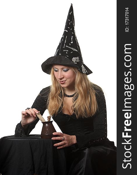 A young woman in a witch costume