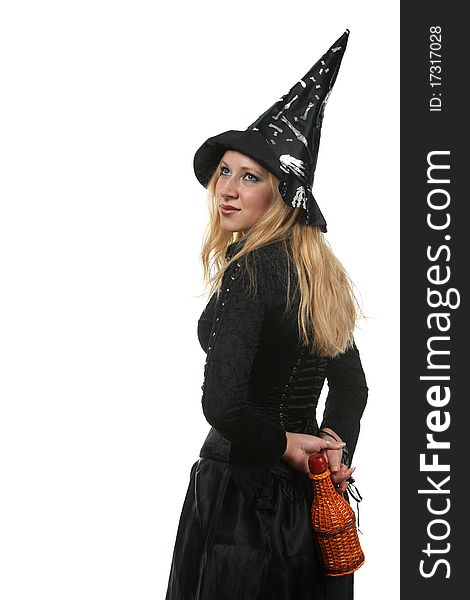 A young woman in a witch costume