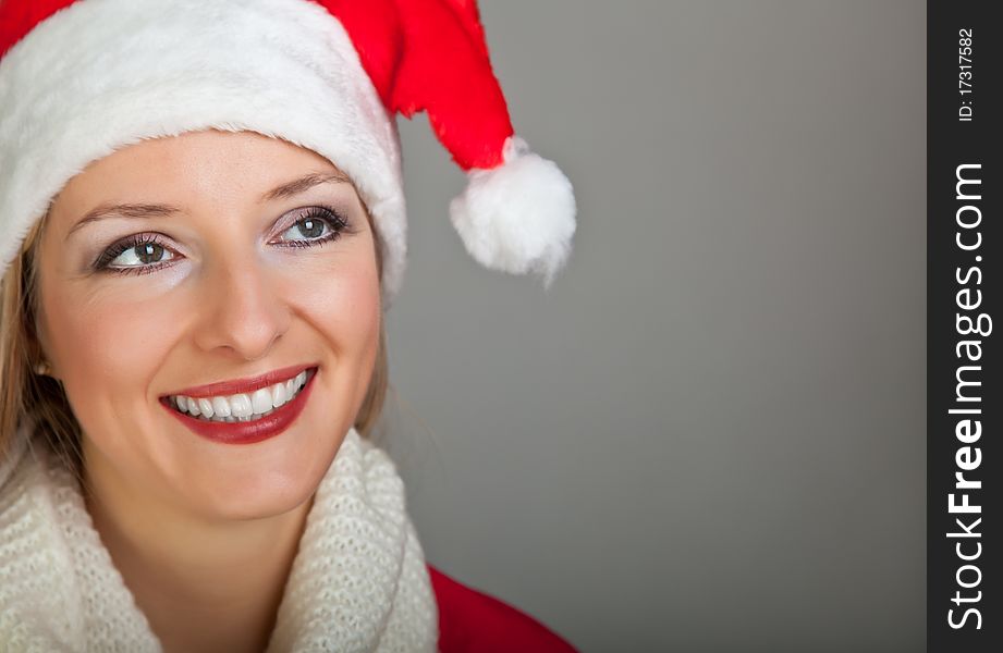 Woman in santa hat with presents