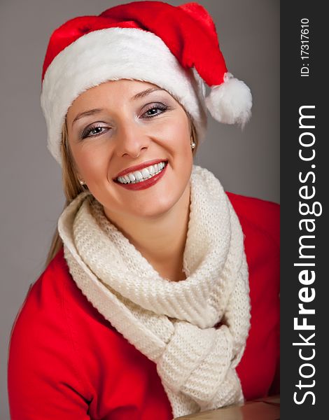 Woman in santa hat with presents