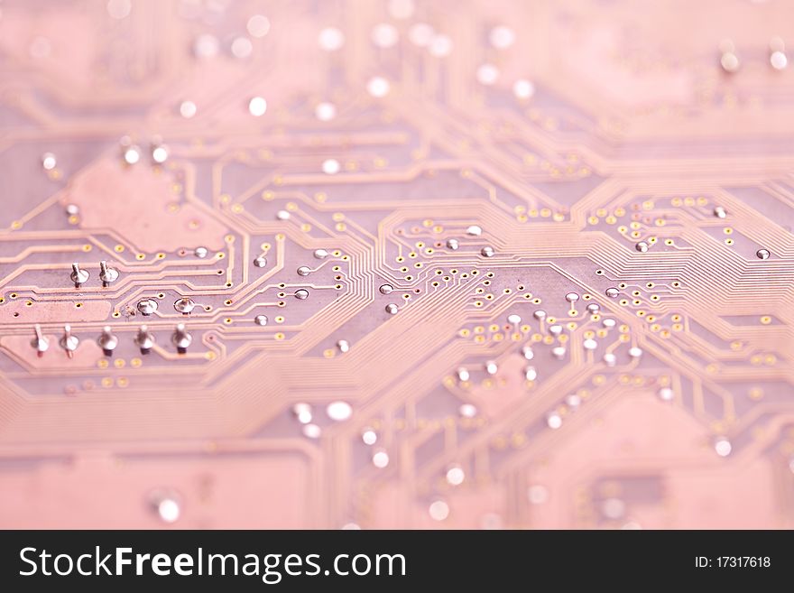 A close up shot of the backside of a computer circuit board, also known as a motherboard. A close up shot of the backside of a computer circuit board, also known as a motherboard