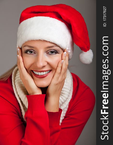 Woman in santa hat with presents