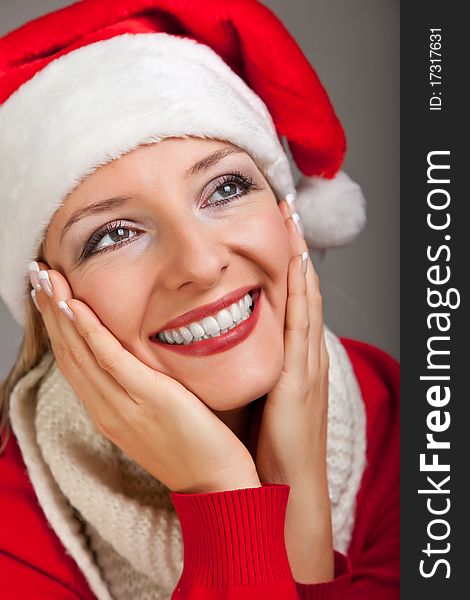 Woman in santa hat with christmas presents isolated on white background. Woman in santa hat with christmas presents isolated on white background