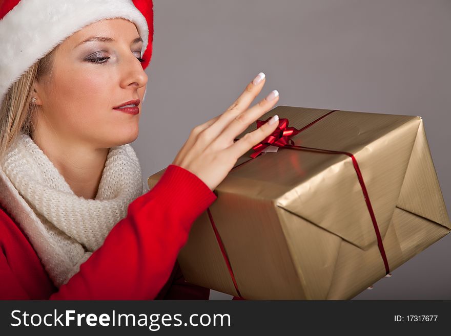 Woman in santa hat with christmas presents isolated on white background. Woman in santa hat with christmas presents isolated on white background