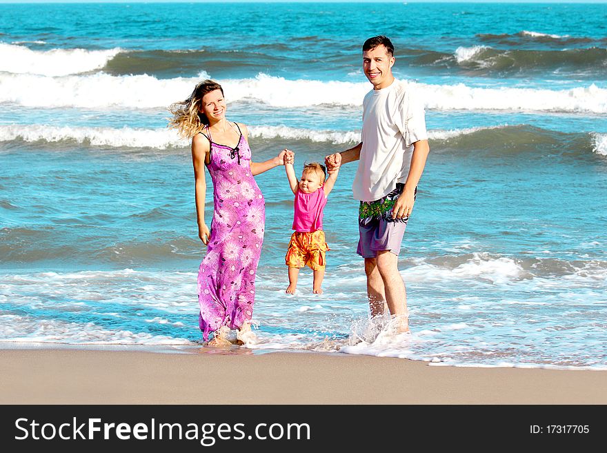 Family on the shore of the sea. Family on the shore of the sea