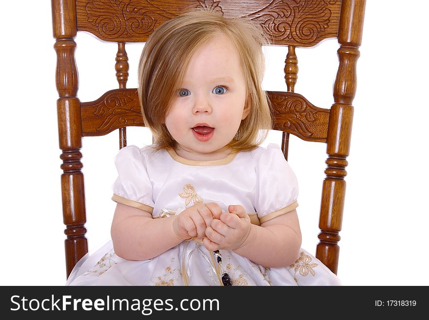 Adorable Baby Girl playing with beads isolated on white