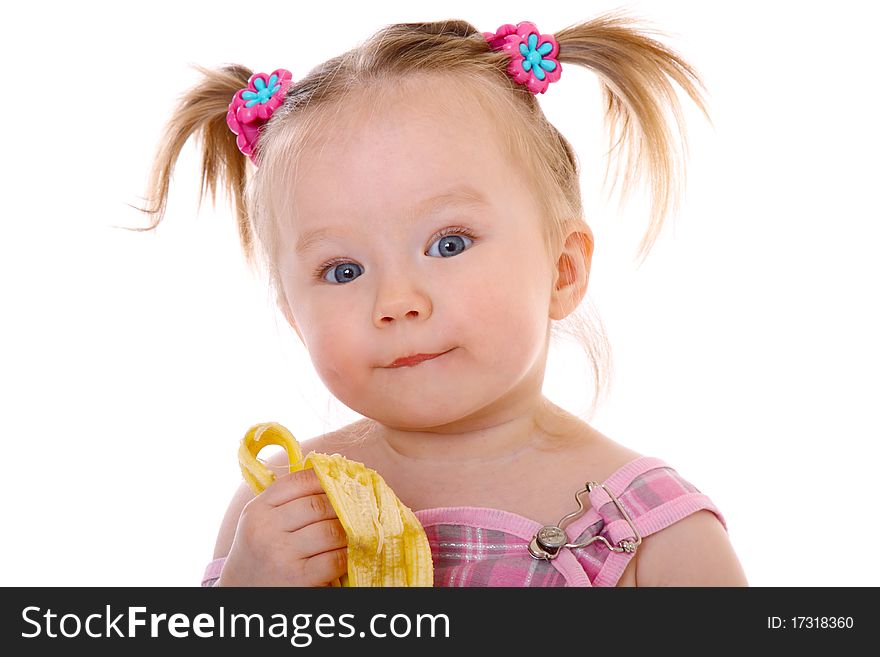Adorable and cute toddler eats banana, enjoying and posing. Adorable and cute toddler eats banana, enjoying and posing