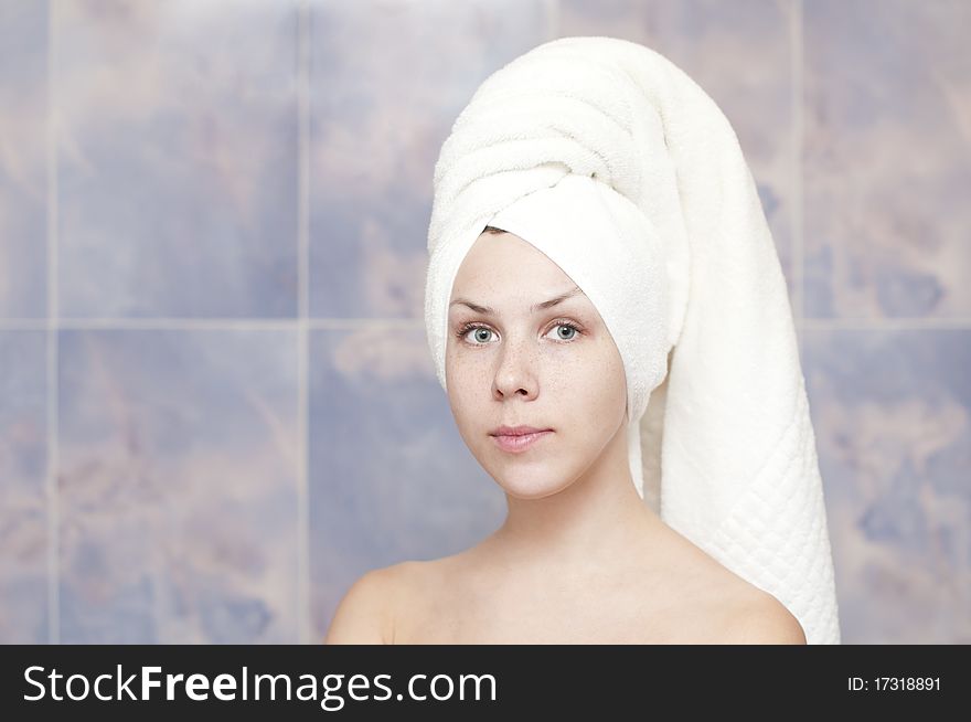 Young woman with a towel in the bath. Young woman with a towel in the bath
