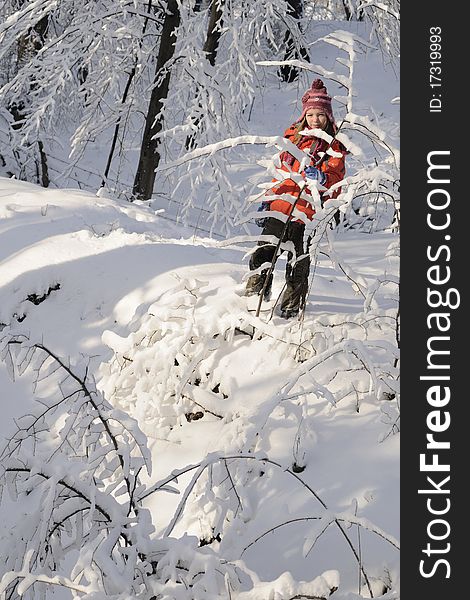 Child having fun with snow from branches in winter season. Child having fun with snow from branches in winter season