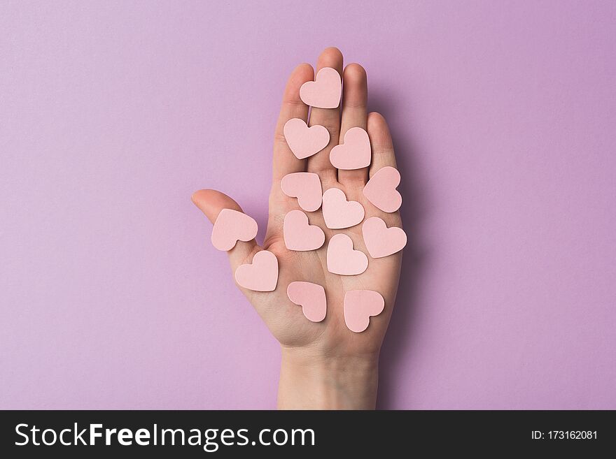 Cropped View Of Woman Holding Pink Paper Hearts On Violet Backgroun.