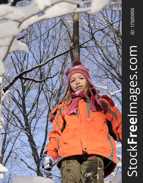 White girl posing in winter season, snow on branches. White girl posing in winter season, snow on branches