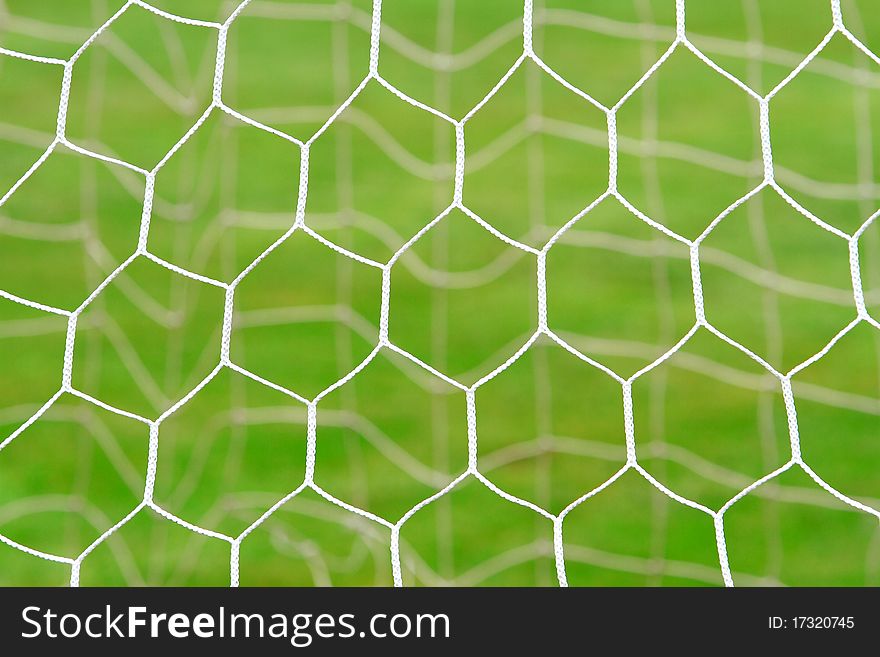 Closeup of soccer net in soccer field