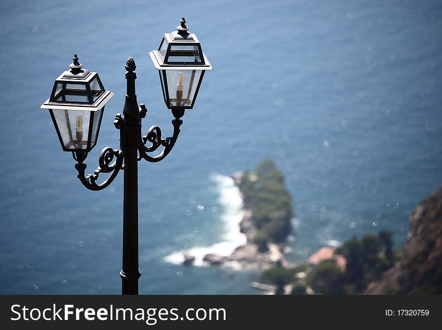 Lantern in park  sea on back