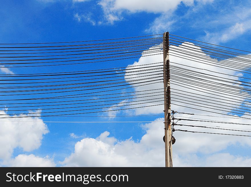 Electrical towers and power lines with blue sky background