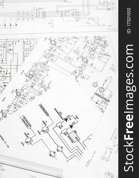 The approximation using a magnifying glass on the electronic schematic diagram.Ideal technology background.