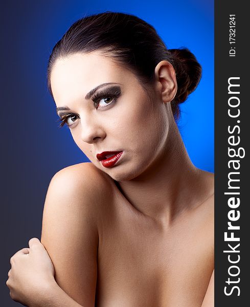 Beautiful woman over color  background with beautiful makeup. Beautiful woman over color  background with beautiful makeup