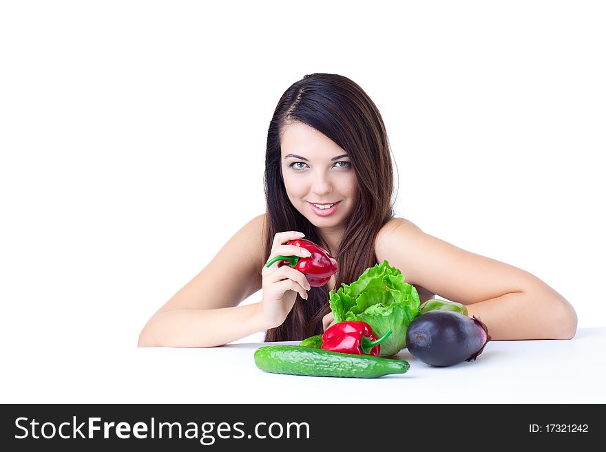 Young girl with  vegetables over white background