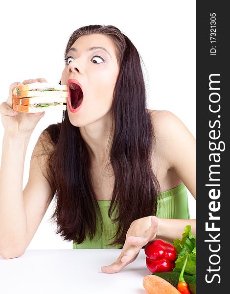 Young girl with  vegetables over white background