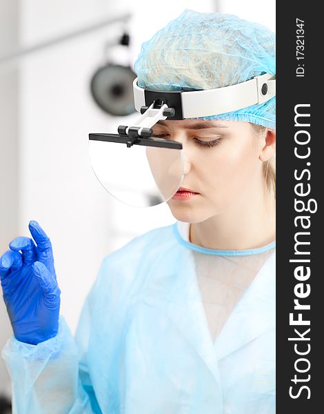 Beautiful woman doctor in uniform over window