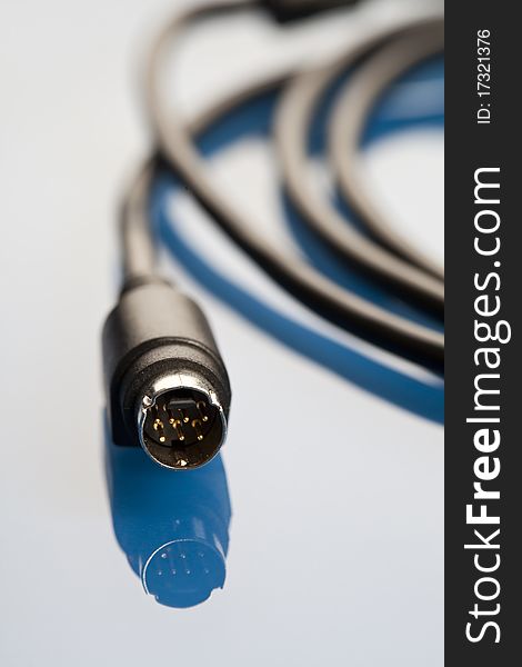 Colorful coils of cables on a blue background