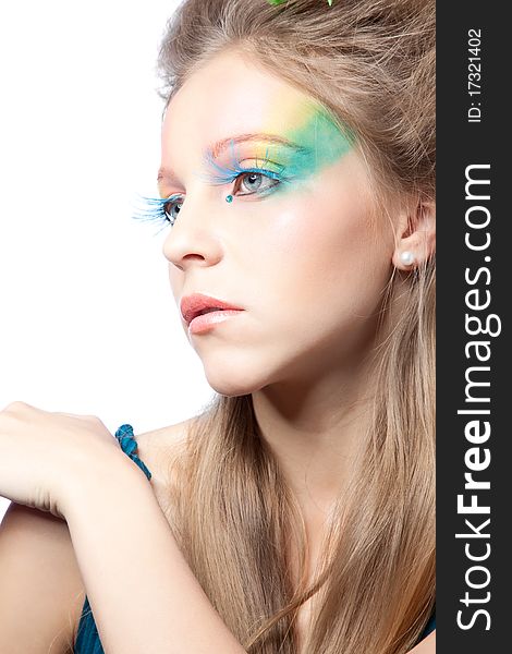 Beautiful woman  with color makeup over white background