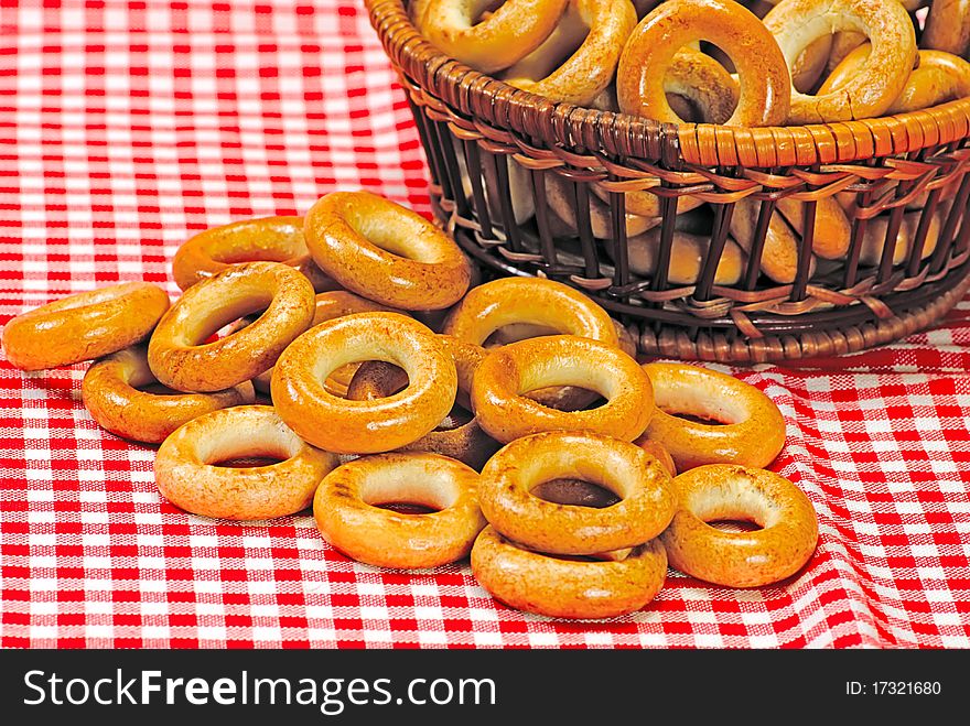 Basket With Bread Ring On A Motley  Background