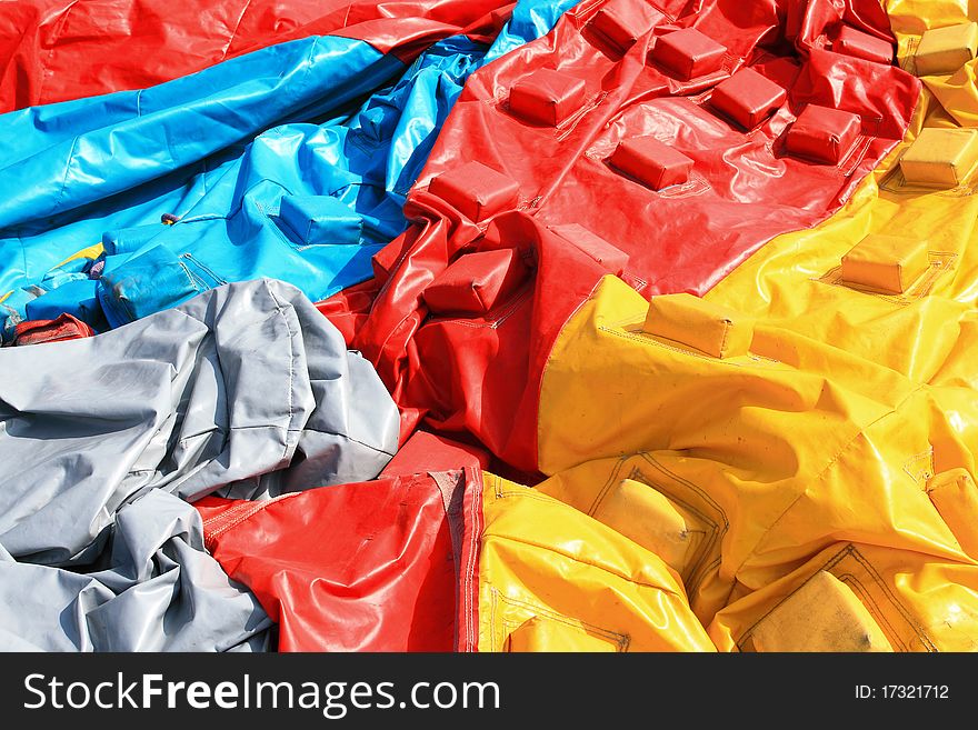 Colorful plastic tent on the ground