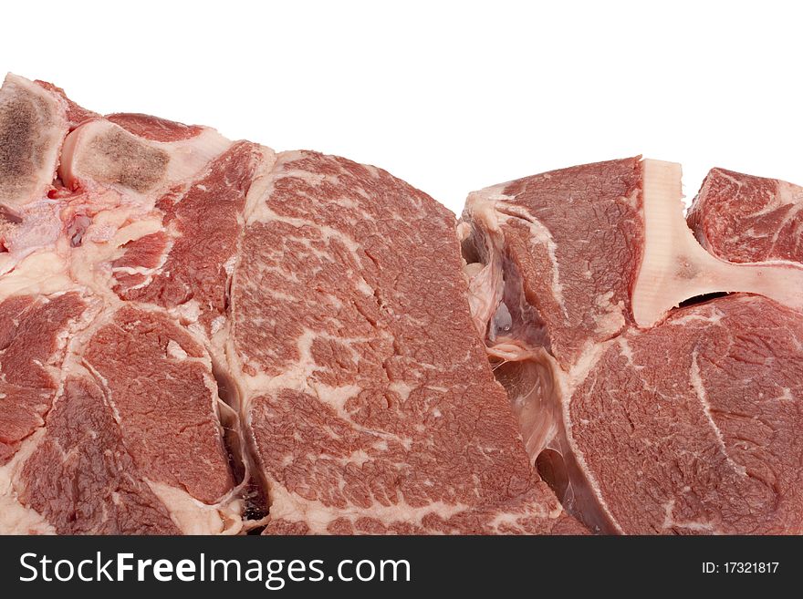 A large piece of raw meat on a white background.