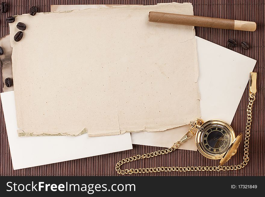 Old tattered sheets of paper on brown wood background for design creativity.