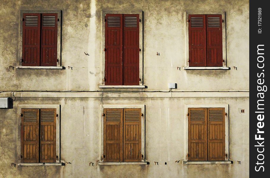 Shuttered windows on an old French building. Shuttered windows on an old French building.