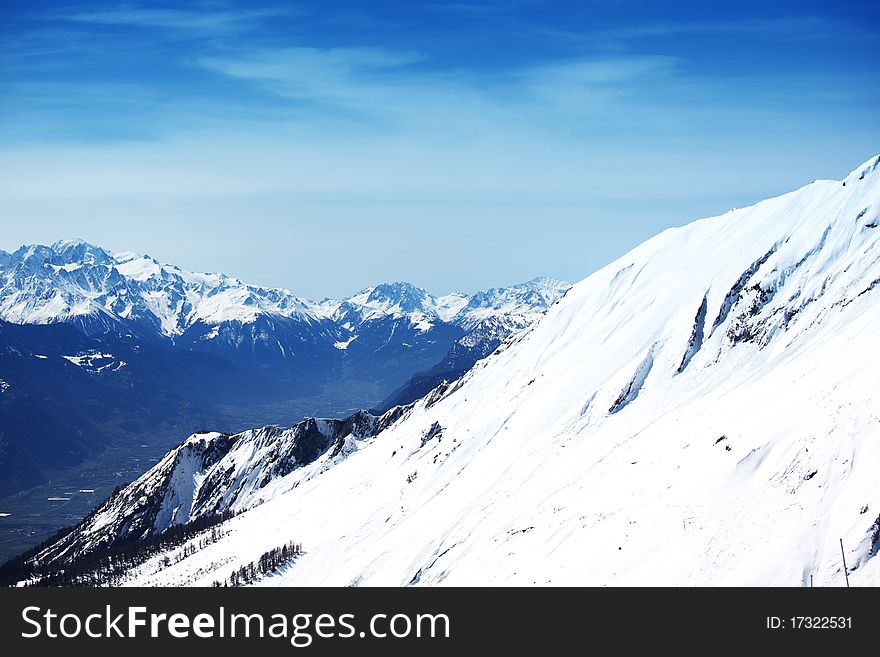 Top of mountains sun in blue sky