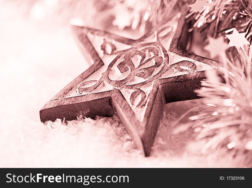 Rustic,wooden christmas star on snow powder. Rustic,wooden christmas star on snow powder