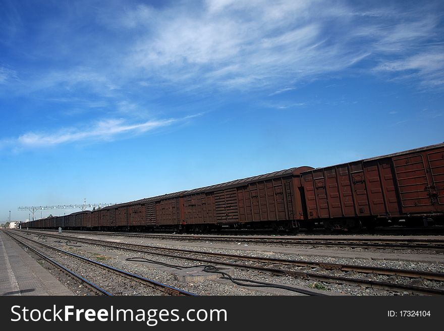 A train at the station under the blue sky.